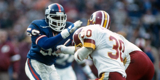 Lawrence Taylor in action against Washington during an NFL football game December 19, 1982 at RFK Stadium in Washington, DC 