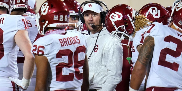 Oklahoma head coach Lincoln Riley talks with his players during a game against Oklahoma State, Saturday, Nov. 27, 2021, in Stillwater, Okla.