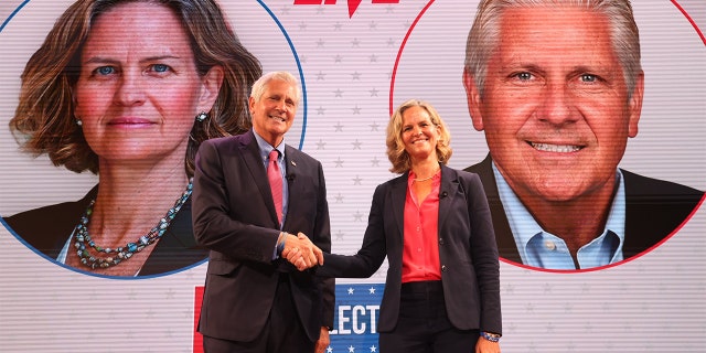Hempstead Town Councilman Bruce Blakeman and Nassau County Executive Laura Curran shake hands after a Newsday Town Hall for the Nassau County executive race in Melville, New York, il ott. 14, 2021.