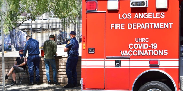 The one-shot Johnson & Johnson Janssen COVIC-19 vaccine is administered to people living on the streets by members of the Los Angeles Fire Department's Covid Outreach unit in Los Angeles, on June 14, 2021.