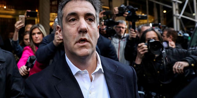 FILE PHOTO: Michael Cohen, U.S. President Donald Trump's former lawyer, leaves his apartment to report to prison in Manhattan, New York, U.S., May 6, 2019.