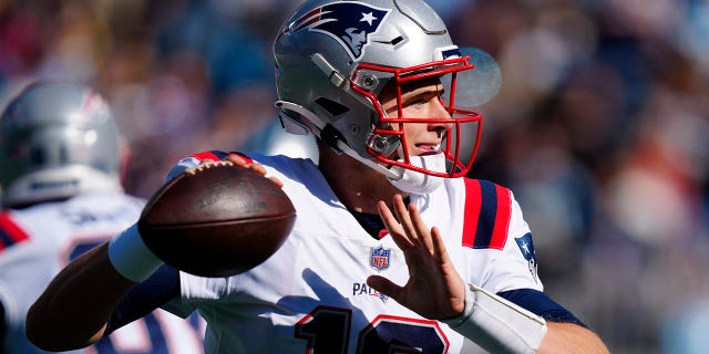 New England Patriots quarterback Mac Jones passes during the first half of an NFL football game against the Carolina Panthers Sunday, Nov. 7, 2021, in Charlotte, N.C.