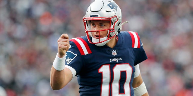 New England Patriots quarterback Mac Jones celebrates a touchdown during the second half of the game against the Cleveland Browns on Nov. 14, 2021, in Foxborough, Massachusetts.