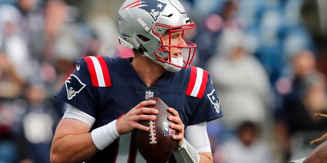 New England Patriots quarterback Mac Jones (10) warms up prior to an NFL football game against the Cleveland Browns, Sunday, Nov. 14, 2021, in Foxborough, Mass.