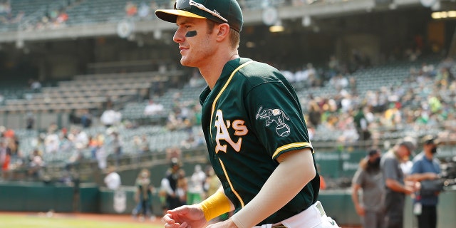 OAKLAND, CALIFORNIA - SEPTEMBER 25: Mark Canha #20 of the Oakland Athletics leaves the dugout before the game against the Houston Astros at RingCentral Coliseum on September 25, 2021 in Oakland, California.