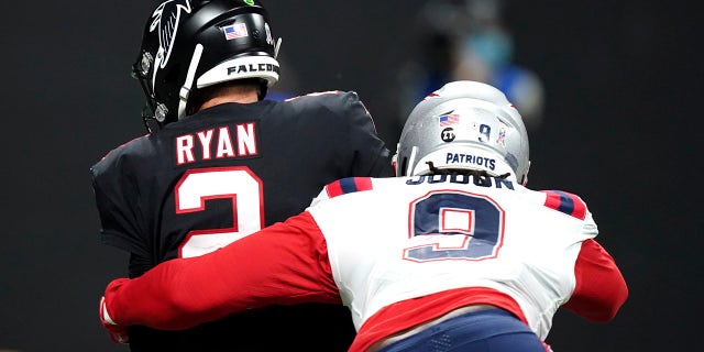 New England Patriots outside linebacker Matt Judon (9) sacks Atlanta Falcons quarterback Matt Ryan (2) during the first half of an NFL football game, Thursday, Nov. 18, 2021, in Atlanta.