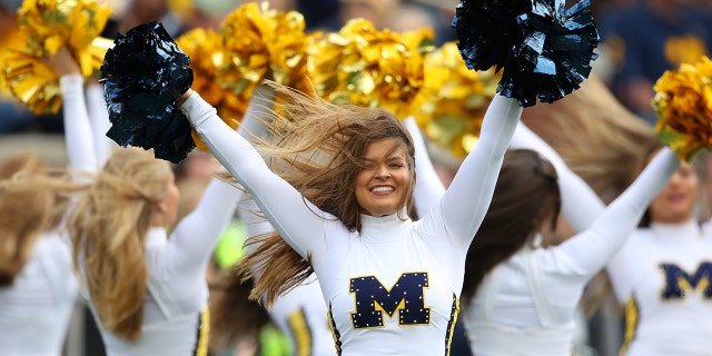 A member of the Michigan Wolverines dance team performs while playing the Iowa Hawkeyes at Michigan Stadium on Oct. 5, 2019, in Ann Arbor, Michigan. Michigan won the game 10-3.