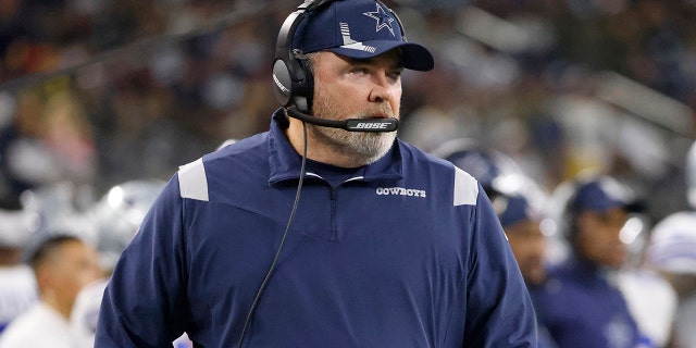 Dallas Cowboys head coach Mike McCarthy watches play against the Las Vegas Raiders in the first half of an NFL football game in Arlington, Texas, Thursday, Nov. 25, 2021.
