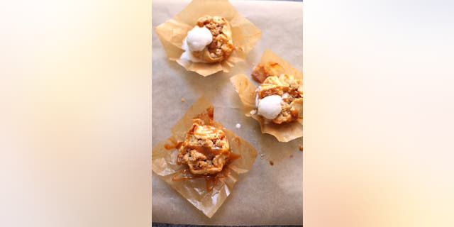 These mini caramel apple pies from Studio Delicious are made with peeled apples, cinnamon, nutmeg and vanilla.