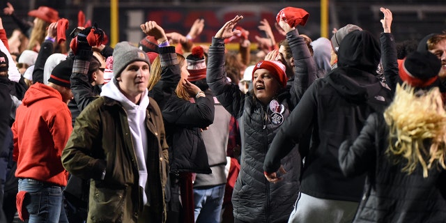 North Carolina State Wolfpack fans celebrate a win over the North Carolina Tar Heels during the second half at Carter-Finley Stadium Nov 26, 2021. The Wolfpack won 34-30.