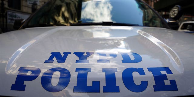 A New York City police car is pictured in November 2021. The Justice Department says as part of its civil pattern or practice investigation, it will reach out to community groups and members of the public.