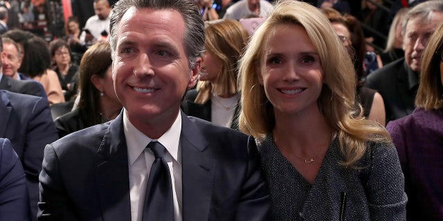 California Gov. Gavin Newsom and wife Jennifer Siebel attending the Democrats' presidential primary debate at Loyola Marymount University on Dec. 19, 2019, in Los Angeles.