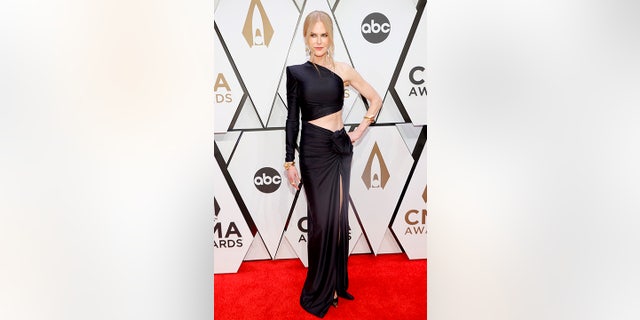 Nicole Kidman showed off her toned abs in a sleek black dress at the Country Music Association Awards on Wednesday night.