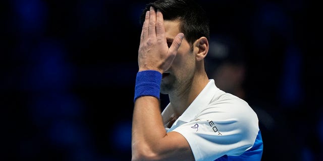 Novak Djokovic reacts during his ATP World Tour Finals match against Alexander Zverev in Turin, Italy, on Saturday, Nov. 20, 2021.