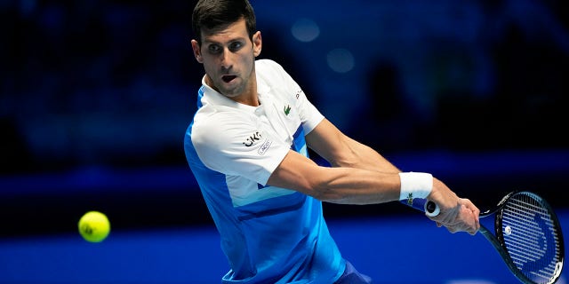 Novak Djokovic returns the ball to Alexander Zverev during the ATP World Tour Finals in Turin, Italy, Saturday, Nov. 20, 2021.