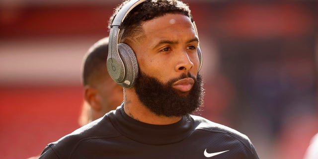 Cleveland Browns wide receiver Odell Beckham Jr. walks off of the field prior to the start of an NFL football game against the Pittsburgh Steelers, Sunday, Oct. 31, 2021, in Cleveland.