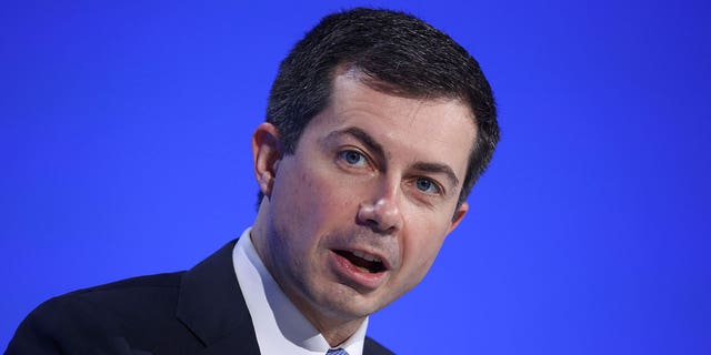 Transportation Secretary Pete Buttigieg speaks during a United Nations climate conference in Scotland on Nov. 10, 2021.