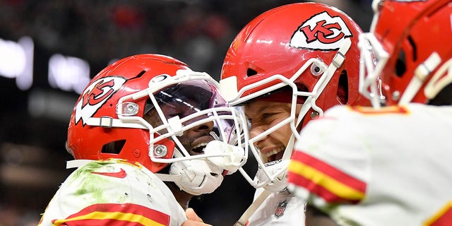 Darrel Williams (31) celebrates after scoring a touchdown with teammate Patrick Mahomes (15) of the Kansas City Chiefs during the second half in the game against the Las Vegas Raiders at Allegiant Stadium on Nov. 14, 2021, en las vegas, Nevada.