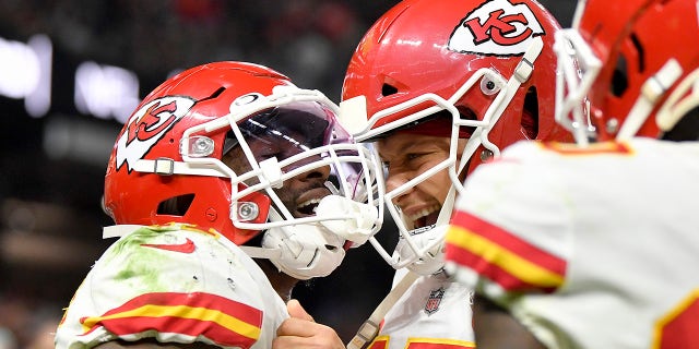 Darrel Williams (31) celebrates after scoring a touchdown with teammate Patrick Mahomes (15) of the Kansas City Chiefs during the second half in the game against the Las Vegas Raiders at Allegiant Stadium on Nov. 14, 2021, en las vegas, Nevada.