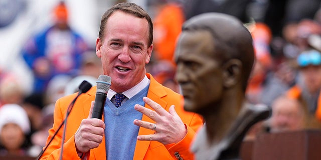Peyton Manning speaks after being inducted into the Denver Broncos Ring of Honor prior to an NFL football game against the Washington Football Team, Sunday, Oct. 31, 2021, in Denver.