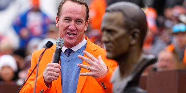 Peyton Manning speaks after being inducted into the Denver Broncos Ring of Honor prior to an NFL football game against the Washington Football Team, Sunday, Oct. 31, 2021, in Denver.