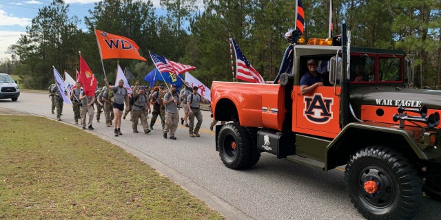 Student veterans march from Auburn to Tuscaloosa during the Operation Iron Ruck march in 2020.