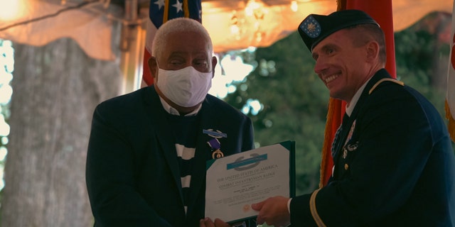 John Spencer Jr. given a Purple Heart, the Combat Infantryman Badge and the Republic of Vietnam Gallantry Cross at the University of North Carolina School of Law for his service.