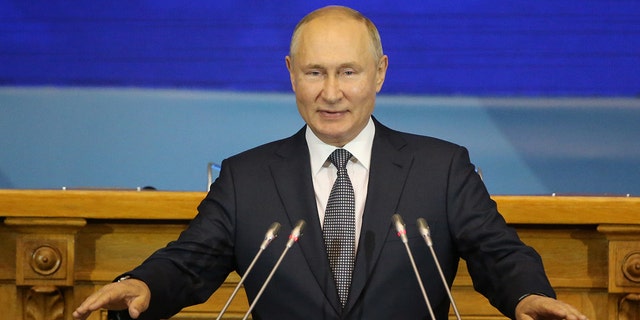 Russian President Vladimir Putin speaks during the 3rd Eurasian Women's Forum (EAFW) plenary meeting on Oct. 14 in Saint Petersburg, Russia. Recently, Putin spoke about building up the country's defense amid NATO's military activities near Russia's borders.