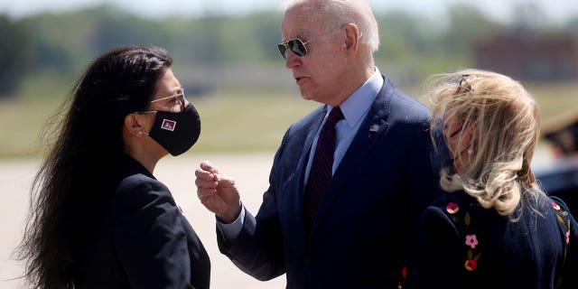 President Joe Biden is greeted by U.S. Rep. Debbie Dingell (D-MI) and U.S. Rep. Rashida Tlaib at Detroit Metropolitan Wayne County Airport, Detroit, Michigan,U.S., May 18, 2021. REUTERS/Leah Millis/File Photo