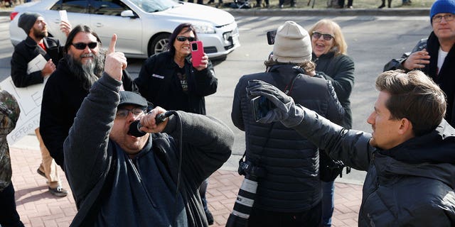 People react to the verdict in the trial of Kyle Rittenhouse, outside the Kenosha County Courthouse in Kenosha, Wisconsin, U.S., November 19, 2021.