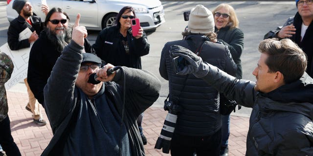 People react to the verdict in the trial of Kyle Rittenhouse, outside the Kenosha County Courthouse in Kenosha, Wisconsin, U.S., November 19, 2021.