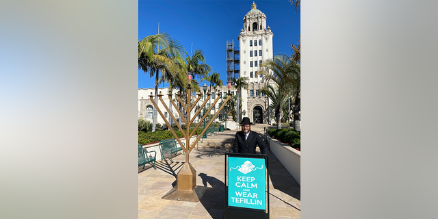 Rabbi Yosef Cunin in front of Beverly Hills City Hall.