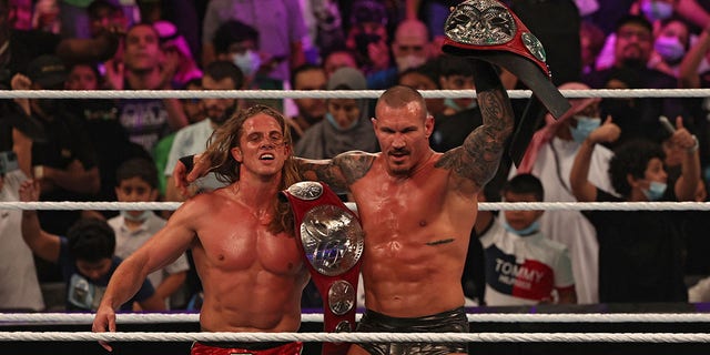 Randy Orton and Matt Riddle celebrate their win in the World Wrestling Entertainment (WWE) Crown Jewel pay-per-view in the Saudi capital Riyadh on Oct. 21, 2021.