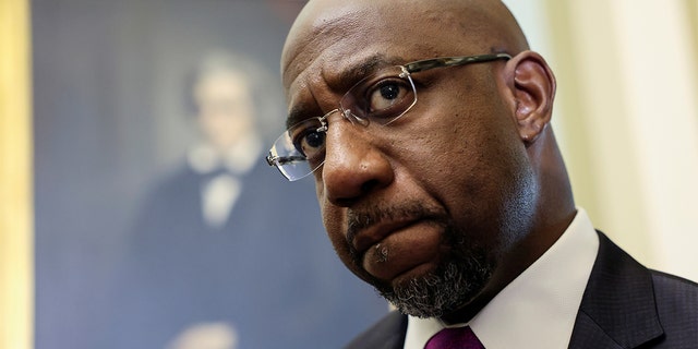 Sen. Raphael Warnock, D-Ga., arrives for the Senate Democrats' weekly policy lunch at the U.S. Capitol in Washington June 15, 2021. 