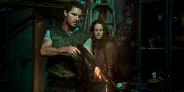 Robbie Amell and Kaya Scodelario in ‘Resident Evil: Welcome to Raccoon City.’