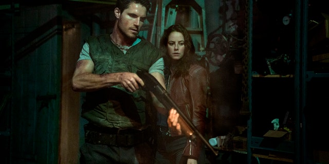 Robbie Amell and Kaya Scodelario in ‘Resident Evil: Welcome to Raccoon City.’