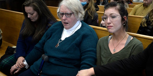 From left, Kariann Swart, Joseph Rosenbaum's fiancee, Susan Hughes, Anthony Huber's great aunt, and Hannah Gittings, Anthony Huber's girlfriend, listen as Kyle Rittenhouse is found not guilty on all counts at the Kenosha County Courthouse in Kenosha, Wis., on Friday, Nov. 19, 2021.