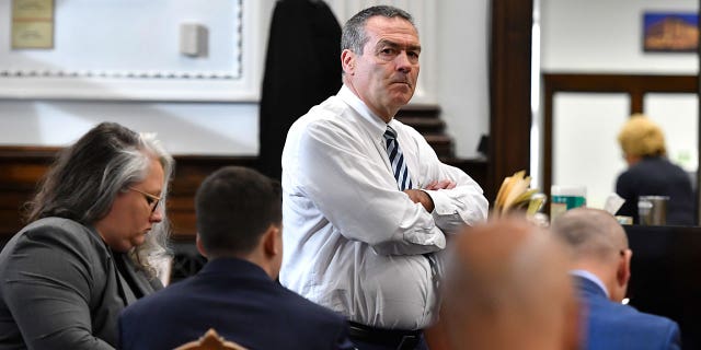 Kyle Rittenhouse's leading attorney, center, is standing by Mark Richards as he waits for the opening day at Kenosha County Courthouse on November 15, 2021 in Kenosha, Wisconsin. (Photo by Sean Krajacic-Pool / Getty Images)