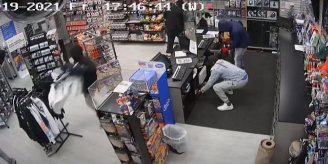 Suspects are seen looting a store in Chicago's Chatham neighborhood on Friday night. (Chicago Police)