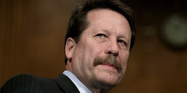 FILE - Dr. Robert Califf awaits the start of his nomination hearing before the Senate Health, Education, Labor and Pensions Committee November 17, 2015, in Washington, D.C.