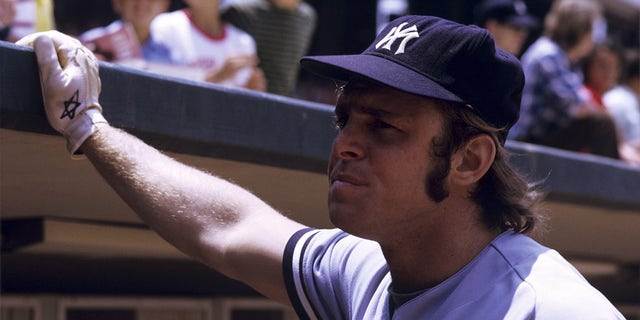 First baseman Ron Blomberg of the New York Yankees looks into the crowd with his hand against the facing of the roof of the dugout prior to a doubleheader on June 17, 1973, against the California Angels at Anaheim Stadium in Anaheim, California.