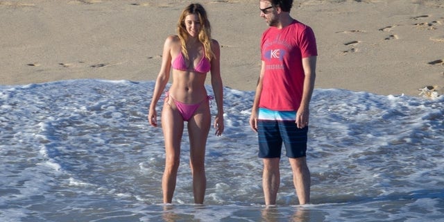 Not just friends after all! Jason Sudekis confirms his relationship with stunning model and actress, Keeley Hazell as the two enjoy a romantic getaway in Cabo. The 46-year-old comedian was spotted wrapping his arms around the 35-year-old English model’s waist and kissing her passionately as the two stepped out on the beach and dipped their feet in the water on Monday.