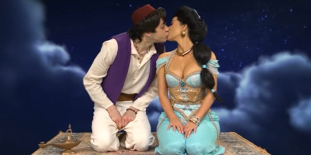 Kim Kardashian and Pete Davidson kiss during an episode of ‘SNL.’ Davidson is reportedly leaving the sketch comedy show after eight seasons.