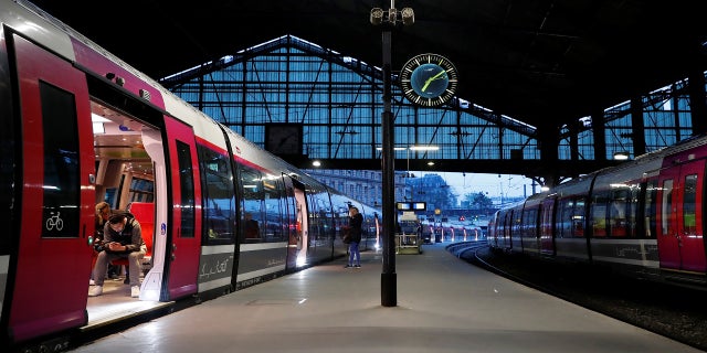 Commuters wait for a train to leave the Saint-Lazare train station in Paris during the fourth day of a nationwide strike by French SNCF railway workers in France in April 2018.