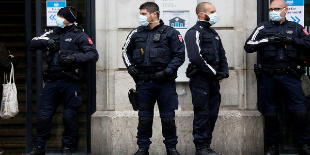Rail security guards from the SNCF (French state-owned railway company) stand outside the Saint-Lazare railway station in Paris, on the first day mask usage is mandatory in public transport, after France begun a gradual end to a nationwide lockdown due to the coronavirus disease in May 2020.