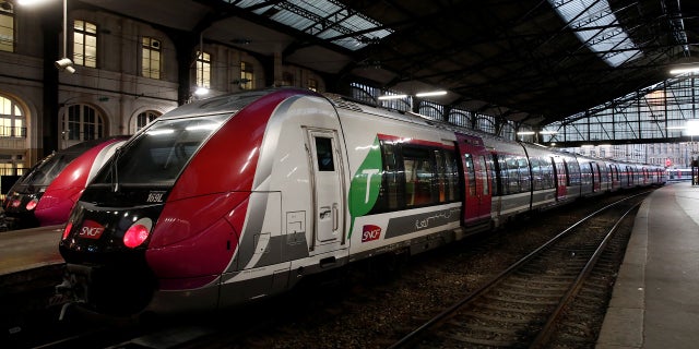 A Transilien regional train, operated by French national railway operator SNCF, stands at a platform at the Saint-Lazare railway station in Paris, France, in November 2019.