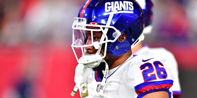 Saquon Barkley #26 of the New York Giants looks on during warmups before the game against the Tampa Bay Buccaneers at Raymond James Stadium on Nov. 22, 2021 in Tampa, Florida.