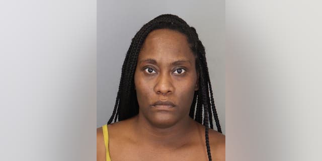 Mother Sharon Hall allegedly shot at two teens who attend the same school as her child.