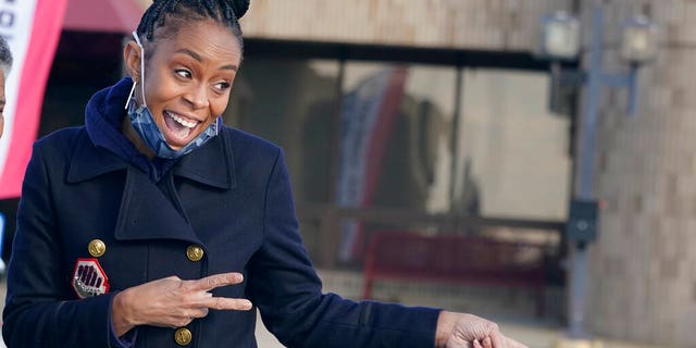 Democratic candidate Shontel Brown shares a laugh with people at the Bedford Community Center, Tuesday, Nov. 2, 2021, in Bedford Heights, Ohio.  (AP Photo/Tony Dejak)