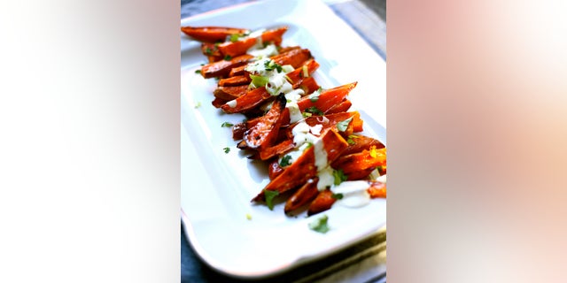 Studio Delicious' spicy sweet potato recipe is made with Greek yogurt, red pepper flakes and and an assortment of other flavorful spices.